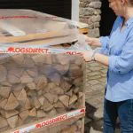 Crate of firewood logs
